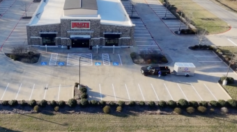 dfw area striping company paints parking lot stripes for an upscale clothing retailer