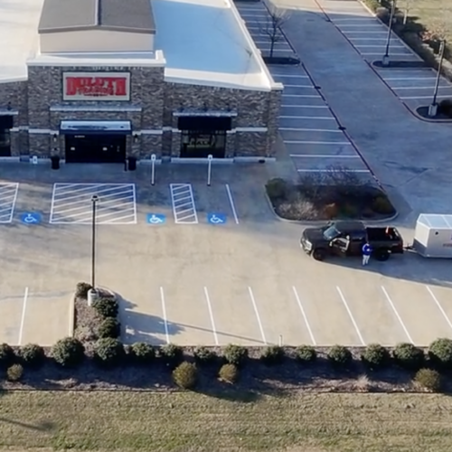 dfw area striping company paints parking lot stripes for an upscale clothing retailer