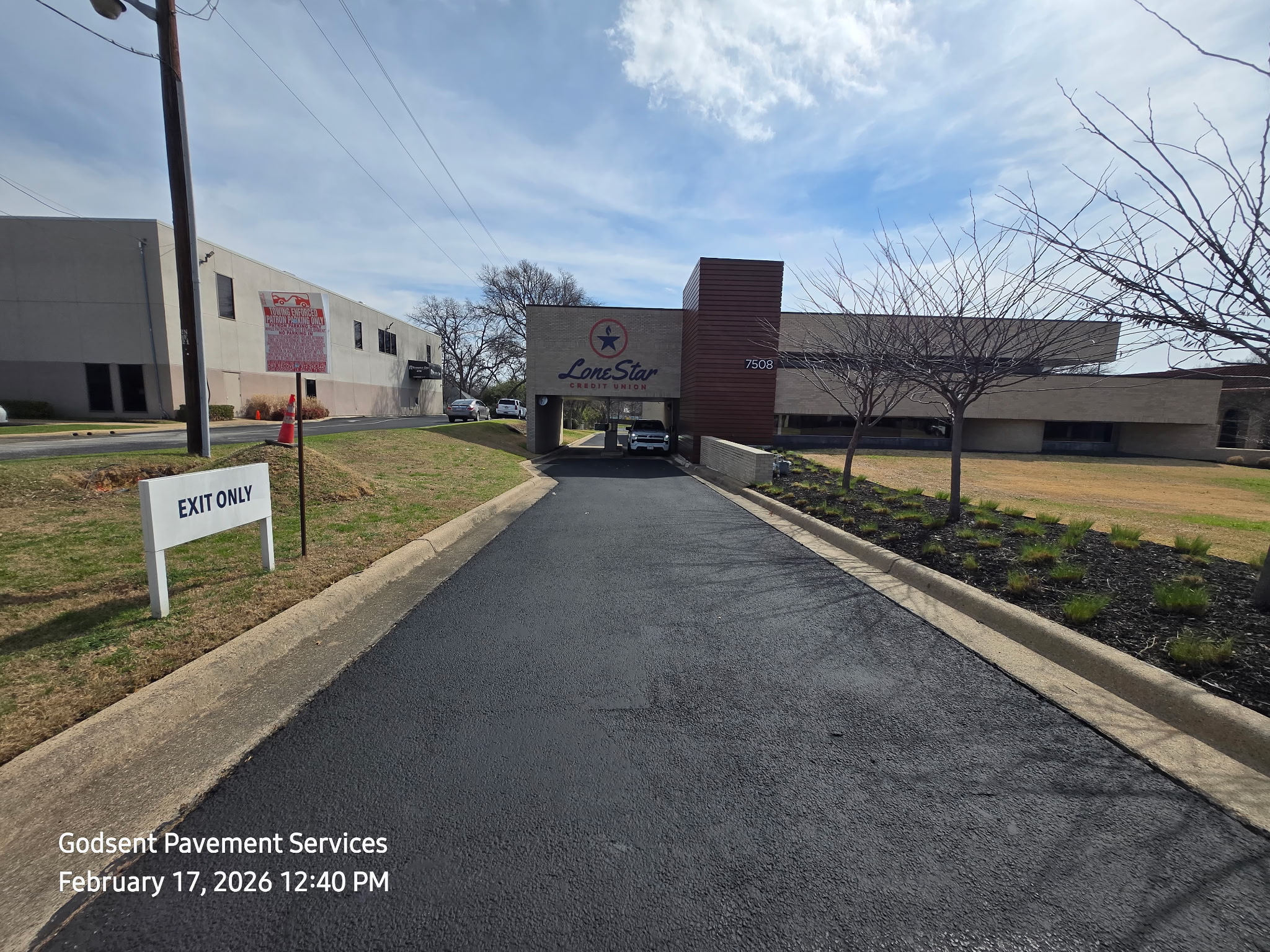 Commercial lot after sealcoating and new striping on a high-traffic site